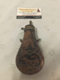 Antique copper gunpowder flask. Measures approx 6.5x3x1 inches.