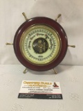 Vintage German Stellar barometer in the shape of a ships wheel. Measures approx 6.5x6.5x2 inches.