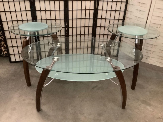 Pair of modern glass top end tables and a coffee table. approx 24x24x26 inches....