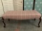 Modern upholstered bench seat/ settle w/ wood carved legs, approx 43 x 17 x 18 inches