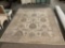 Large wool rug in natural tones with floral design, made in India by LG Sourcing INC. approx 122 x