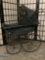 Antique baby buggy / doll carriage with metal frame and wooden handle, carriage cover shows wear