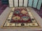 Hand made wool area rug by Direct Home Textile Group. approx. 5x8 feet.
