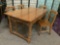 Vintage dining table w/beautiful grain & four wooden chairs.
