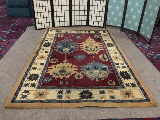 Hand made wool area rug by Direct Home Textile Group. approx. 5x8 feet.