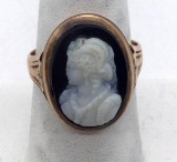 Size 9.5 14k gold tested composite cameo ring. Face measures approx 21.5 mm. Weighs 8.1 g.