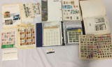 Large collection of hundreds of vintage US and foreign postage stamps in albums.