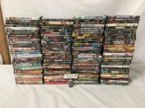 Collection of 130 action, adventure, and thriller movie DVDs: Kiss of the Dragon, Magnum Force, more