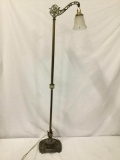 Antique deco cast iron bridge lamp with boat and leaf accents. Approx 54x14x10 inches.