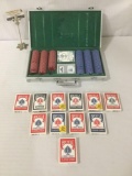 Metal case filled w/poker chips & 13 packs of playing cards, approx. 16x9x2.5 inches