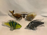 4 large art glass fish sculptures, one marked Dynasty Gallery, approx 10 x 5 x 4 inches.