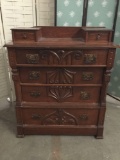 Antique c. 1870s Victorian dresser with carved front and scalloped dovetail joints. Shows wear.