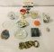 Lot of 13 trinkets, incl. candles, a Greek owl bottle opener, an Asian cup, and more.