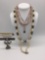 Four pieces of estate jewelry, incl. plastic, bead, metal, & rhinestone necklaces.