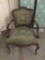 Vintage needlepoint upholstered chair with hand carved accents. Measures approx 34x24x24 inches.