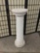 White plaster pillar.