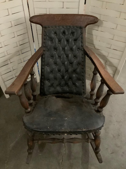 Antique wood carved rocking chair w/ leather seat and back, shows wear, 28 x 35 x 35 inches