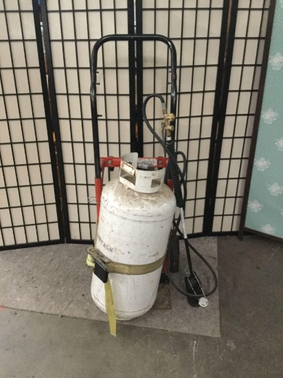 Torch with propane tank and hand truck. approx 46x22x15 inches.