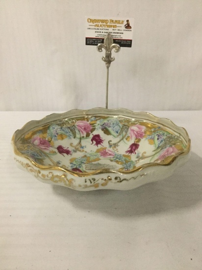 Shapely gold tone candy bowl w/floral & beach scene designs, approx. 10x10x3 inches.