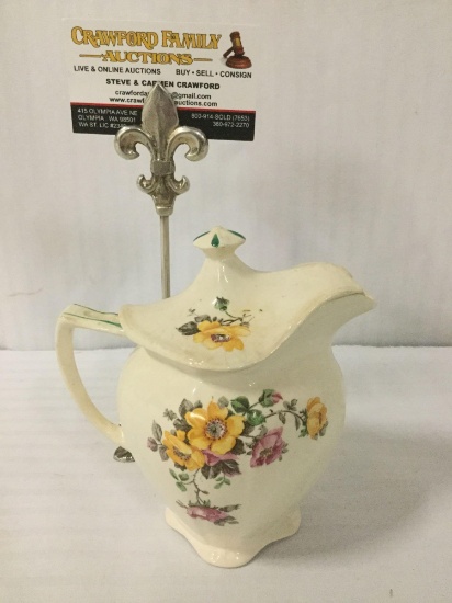 TST Co. creamer/pitcher w/lid & floral designs, approx. 6x4x6 inches.
