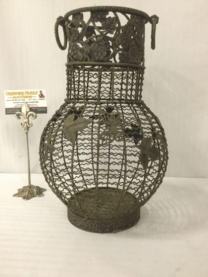 Metal cage vase w/handles & animal & foliage designs, approx. 9x9x14 inches.