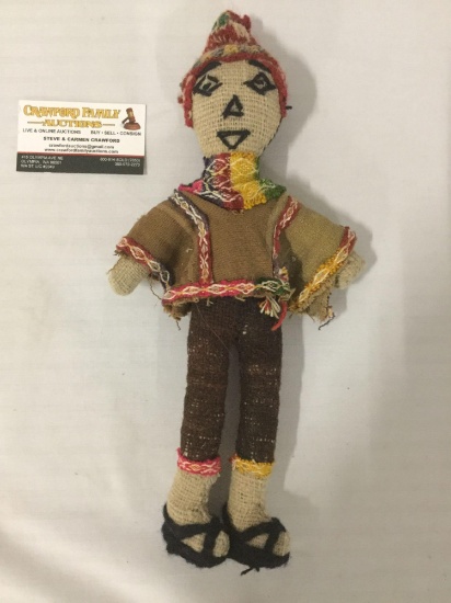 Vintage folk art doll w/ colorful indigenous attire, approx. 7x15x2.5 inches.