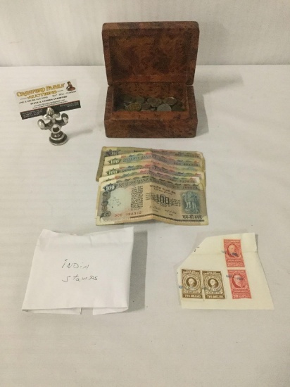 Wooden box full of stamps, rupees, & foreign coins. Approx. 6.5x5x3 inches.