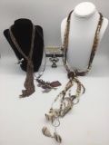 3 pieces of estate jewelry, incl. metal, bead, & feather necklaces, approx. 48x2x1 inches.