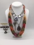 Four pieces of estate jewelry, incl. bead, metal, rhinestone & stone pendant necklaces.