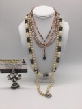 Four pieces of estate jewelry, incl. plastic, bead, metal, & rhinestone necklaces.