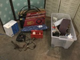 Tub full of misc. hardware, incl. a Craftsmen Saber Saw, sanding paper, pressure washer & more.