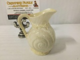 Small Irish Belleek creamer w/ shell designs, approx. 4x3x4 inches.