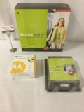 Three Motorola home monitoring/security products in box, incl. a camera, software, & more.