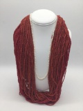 Pair of red bead necklaces, and pearl necklace.