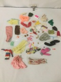 Vintage doll clothing, incl. boots, skirts, sweaters, & more. From companies like Mattel.