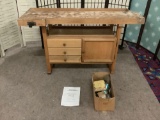 Three-drawer one-cabinet woodworking workbench w/manual. Some wear, see pics.