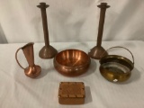 Six vintage copper items. Incl. two candle sticks, a small container, two bowls, one pitcher