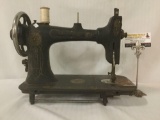 Vintage Bartlett Rotary sewing machine from a sewing table w/floral designs. Sold as is. Shows wear.