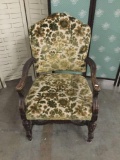 Vintage upholstered armchair with hand carved accents. approx 38x26x34 inches