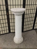 White plaster pillar.
