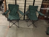 Pair of folding lawn chairs with bags. approx 35x32x17 inches.