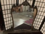 Vintage wood framed mirror with intricate carved detail, has crack in frame - sold as-is