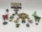 15 small decorative frog figurines & trinkets, largest approx. 2.5x2x1 inches.