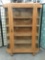 Large antique wooden curio cabinet w/4 shelves, elegant pulls & floral design. Approx. 48x14x72 in.