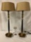 Pair of gold tone/jet black table lamps w/ manila & paisley shades, tested/working, 12x12x30 inches.