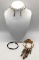 Lot of 3 traditional Asian jewelry pieces. Brass neck cuff, copper cuff bracelet, and stone pendant