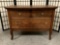 Vintage/antique early 1900s tiger oak three-drawer dresser w/casters, approx. 36x20x27 inches.