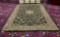 Mohawk Home wool carpet in kerman/jet black w/floral designs, approx. 120x80 inches.