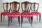 6 antique French dining chairs with red bee motif upholstery. Shows wear. approx 36x18x18 inches.