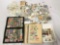 Huge lot of loose US and foreign stamps. Thousands of stamps! Largest book measures approx 12x9.5 in